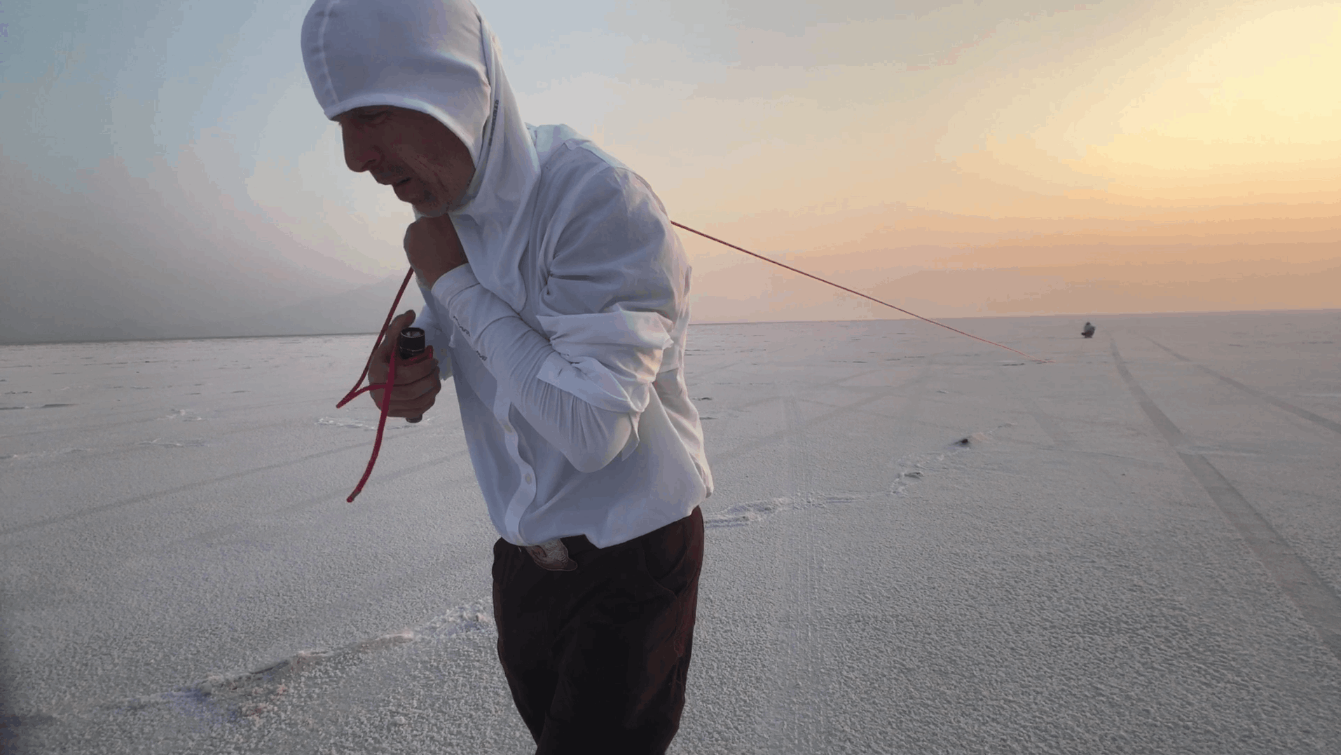 Man walking in desert.